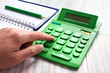 Hand of businessman with calculator.