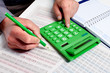 Hand of businessman with calculator.