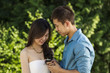 Young adult woman looking at her engagement ring
