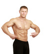 Muscular young man showing abs, isolated o white background