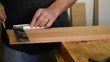 Craftsman or carpenter mark out in a table wood