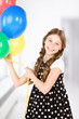 Photo: happy girl with colorful balloons happy girl with colorful balloons