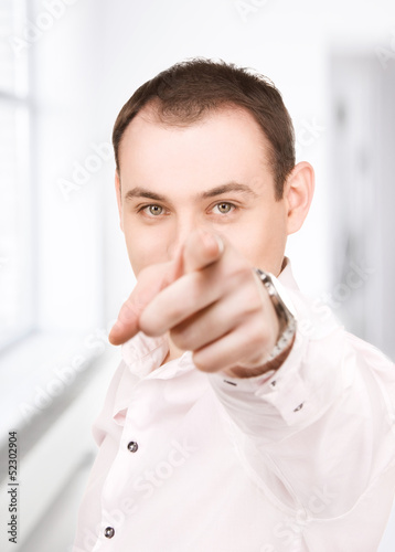 Photo: businessman pointing his finger businessman pointing his finger
