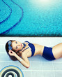 Photo: Summer . Beautiful young woman at a pool Summer . Beautiful young woman at a pool
