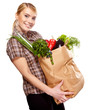 Photo: woman holding a bag full of healthy food. shopping . woman holding a bag full of healthy food. shopping .