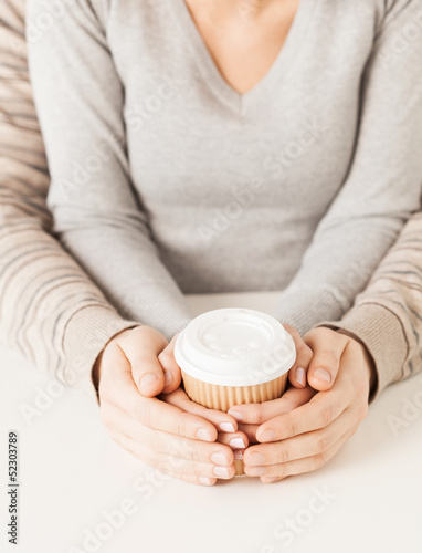 Photo: woman and man with take away coffee cup woman and man with take away coffee cup