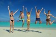group of happy young people have fun on bach