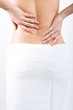Foto: Woman massaging pain back Woman massaging pain back