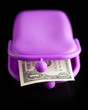 purple wallet with money on black