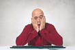 Worried man at office table