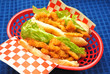 Two Clam Rolls Over a Blue Background