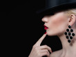 Beautiful girl with red lips and manicure