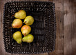 pears in a black basket