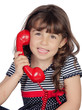 Adorable little girl wiht red phone