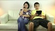 Couple using smartphone and tablet