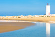 Blue Beach With Lighthouse