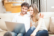 Photo: Couple using a notebook Couple using a notebook