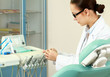Photo: woman dentist at her office woman dentist at her office