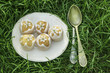 Cakes on grass decorated with edible flowers