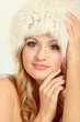 Beauty fashion model girl in a fur hat