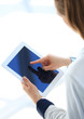 Photo: Businesswoman holding digital tablet Businesswoman holding digital tablet