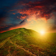 amazing mountain sunset with red clouds