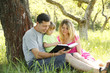 Foto: Young family reading the Bible Young family reading the Bible