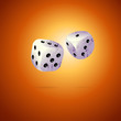 Two dices on brown background