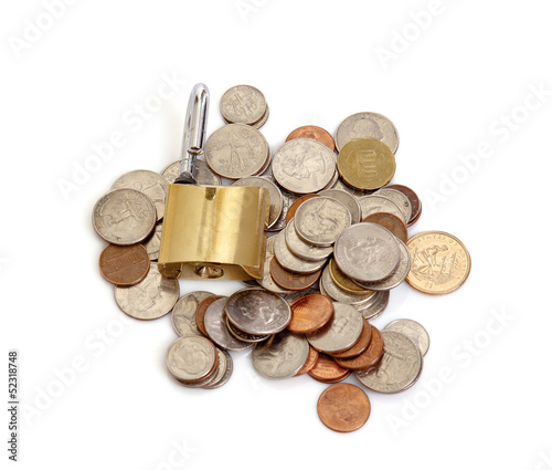 Photo: Padlock on coin pile as a symbol of financial protection Padlock on coin pile as a symbol of financial protection