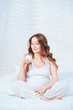 Pregnant woman holding glass of milk