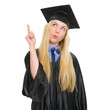 Happy young woman in graduation gown got idea