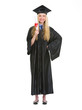 Full length portrait of woman in graduation gown showing diploma