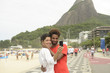 Photo: Multiethnic couple tourists photographing Rio de Janeiro Multiethnic couple tourists photographing Rio de Janeiro