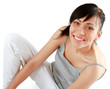A pretty young woman sitting on the floor