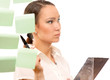 Foto: Closeup of a businesswoman looking at stickers Closeup of a businesswoman looking at stickers