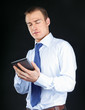 Handsome businessman using computer plane-table