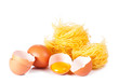Several eggs and pasta on a white