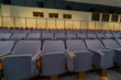 Conference room with comfortable gray cloth seats.