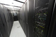 Telecommunication racks in a sealed corridor.