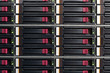 Part of server rack with multiple hard drives.