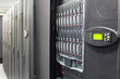 Hard drives and controls in telecommunication rack.