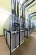 Room with many cables and batteries for backup power system.