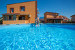 boy sitting at the large pool