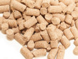 granules of Wheat Bran background. Food for horses and farm anim