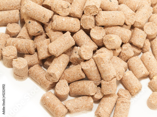 Photo: granules of Wheat Bran background. Food for horses and farm anim granules of Wheat Bran background. Food for horses and farm anim
