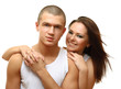 Foto: Young beautiful loving couple is embracing - on white background Young beautiful loving couple is embracing - on white background