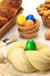Easter sweet bread dough with multicolored eggs