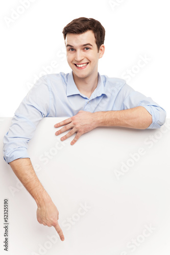 Photo: Man pointing at blank poster Man pointing at blank poster