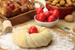 Photo: Easter sweet bread dough with red eggs Easter sweet bread dough with red eggs