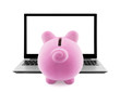 Piggy bank and laptop isolated on white
